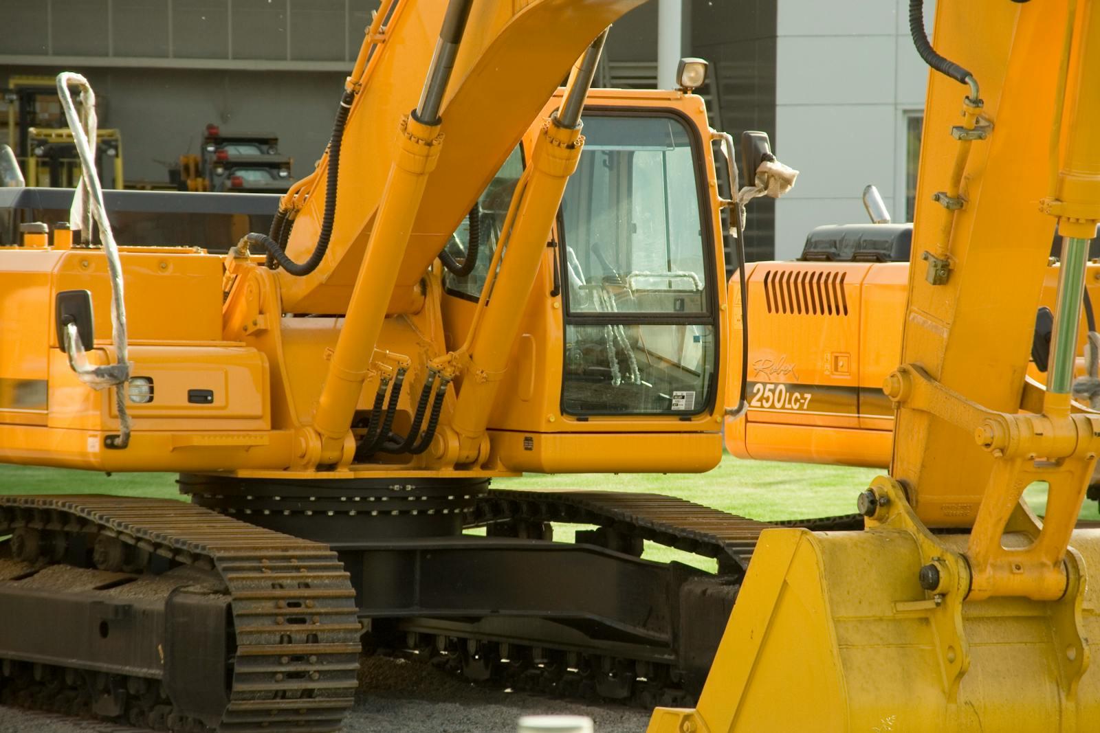 Tier 4 Final excavators with visible engine bay and aftertreatment compartments housing DPF, SCR, and DEF systems